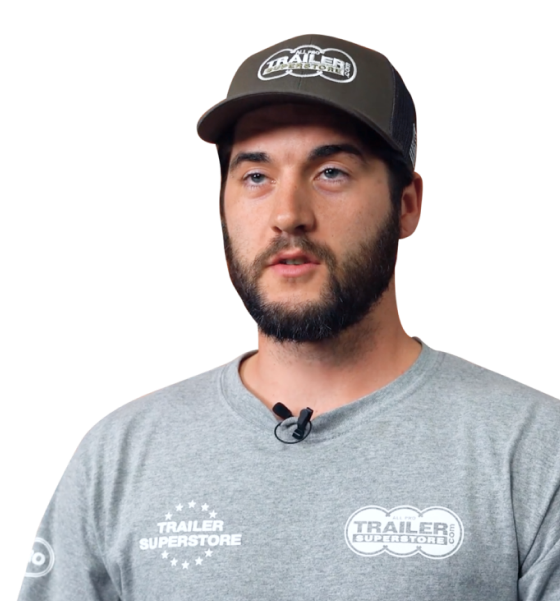 a man wearing a hat and a trailer superstore shirt